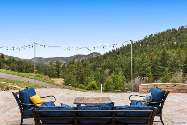 21609 Clarence Ln, Golden, CO 80401 - view of patio with a view of trees and a mountain view