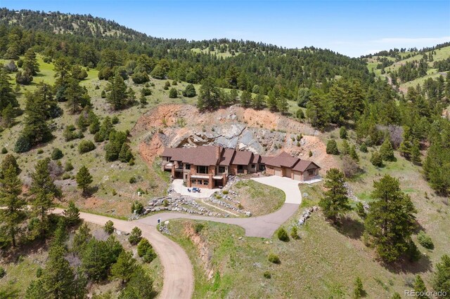 21609 Clarence Ln, Golden, CO 80401 - view of property location with a forest