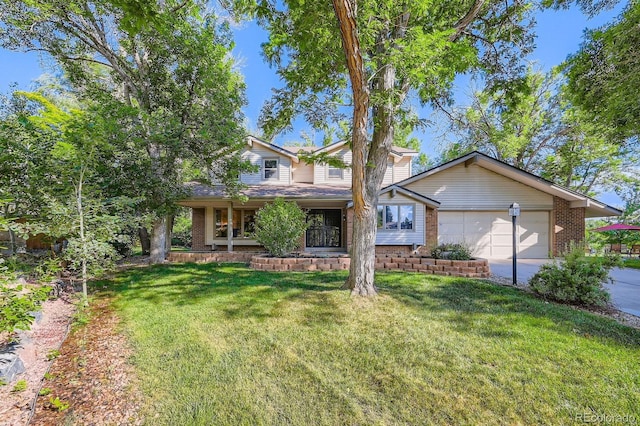 4878 W 98th Ave, Westminster, CO 80031 - view of front of property featuring brick siding, a garage, driveway, and a front lawn