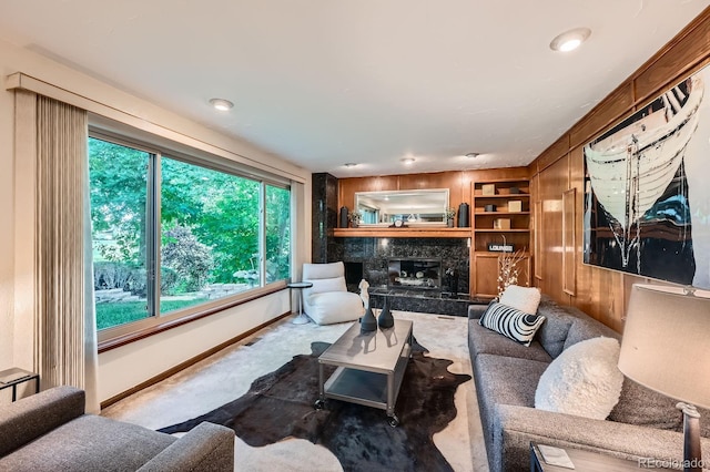 4878 W 98th Ave, Westminster, CO 80031 - carpeted living area featuring plenty of natural light, a premium fireplace, and built in shelves