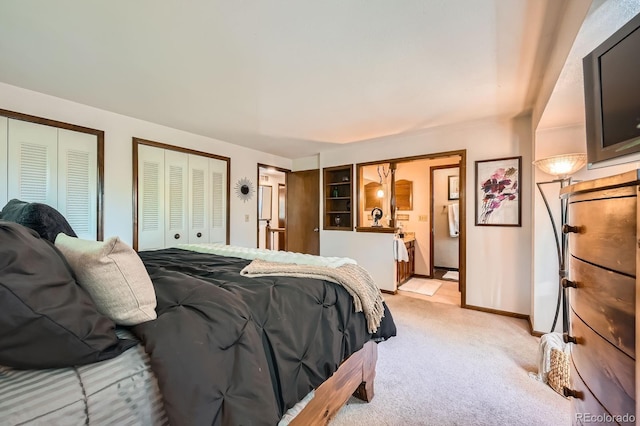 4878 W 98th Ave, Westminster, CO 80031 - bedroom with light colored carpet, two closets, and ensuite bath