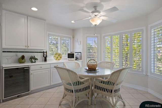 9278 E Aspen Hill Pl, Lone Tree, CO 80124 - dining room with wine cooler, healthy amount of natural light, light tile patterned floors, baseboards, and recessed lighting