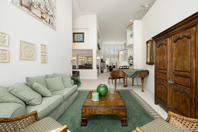 9278 E Aspen Hill Pl, Lone Tree, CO 80124 - living area with a high ceiling, ceiling fan, light colored carpet, and baseboards