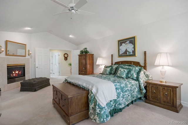 9278 E Aspen Hill Pl, Lone Tree, CO 80124 - bedroom with lofted ceiling, light carpet, a tiled fireplace, and a ceiling fan