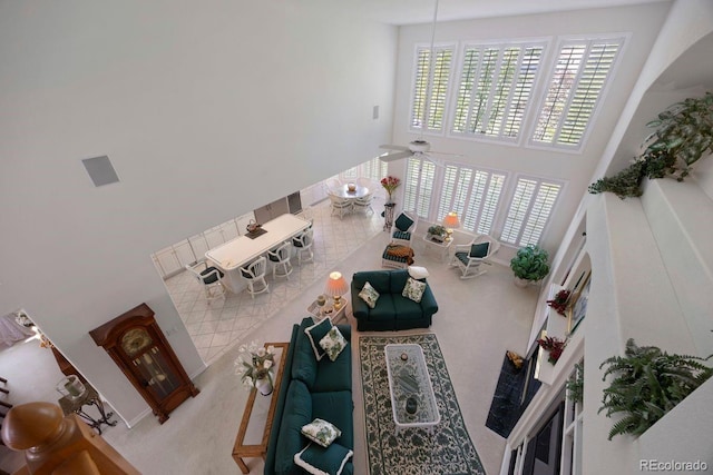 9278 E Aspen Hill Pl, Lone Tree, CO 80124 - living room featuring a high ceiling, ceiling fan, and carpet floors