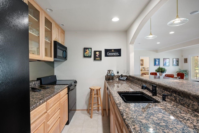 9278 E Aspen Hill Pl, Lone Tree, CO 80124 - kitchen with black appliances, a sink, light brown cabinetry, glass insert cabinets, and light tile patterned floors