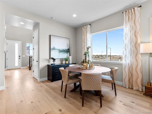 dining room with light wood-type flooring