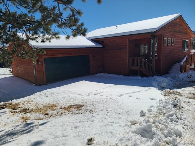 view of snow covered garage