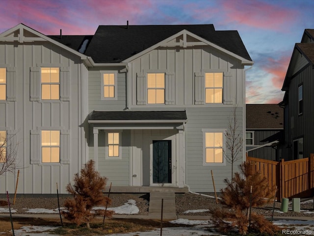 view of back house at dusk