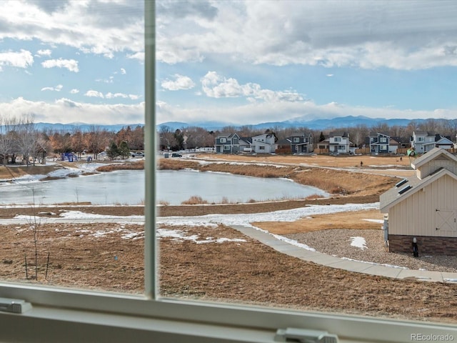 view of water feature with a mountain view and a residential view