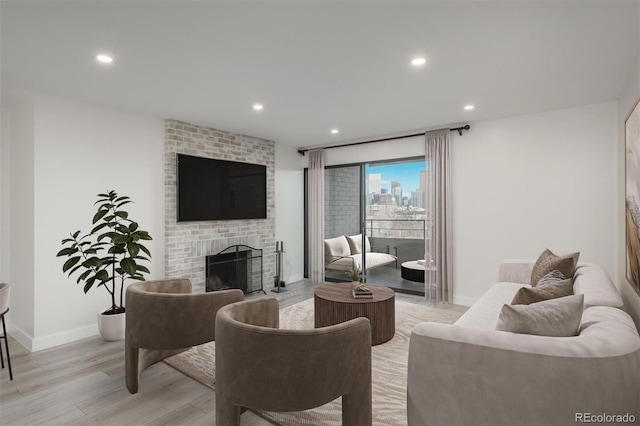 800 N Pearl St Unit 611, Denver, CO 80203 - living room with light wood-style floors, a brick fireplace, baseboards, and recessed lighting