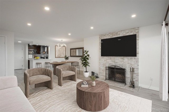 800 N Pearl St Unit 611, Denver, CO 80203 - living area with light wood-type flooring, recessed lighting, and a brick fireplace