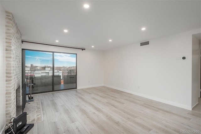 800 N Pearl St Unit 611, Denver, CO 80203 - unfurnished living room featuring light wood-style floors, recessed lighting, and baseboards