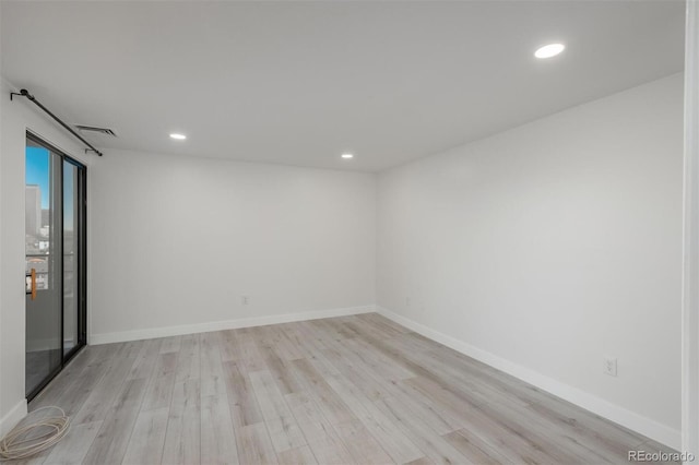 800 N Pearl St Unit 611, Denver, CO 80203 - spare room with light wood-style floors, recessed lighting, and baseboards