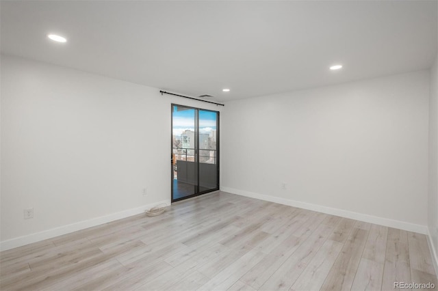 800 N Pearl St Unit 611, Denver, CO 80203 - empty room featuring light wood-style flooring, recessed lighting, and baseboards