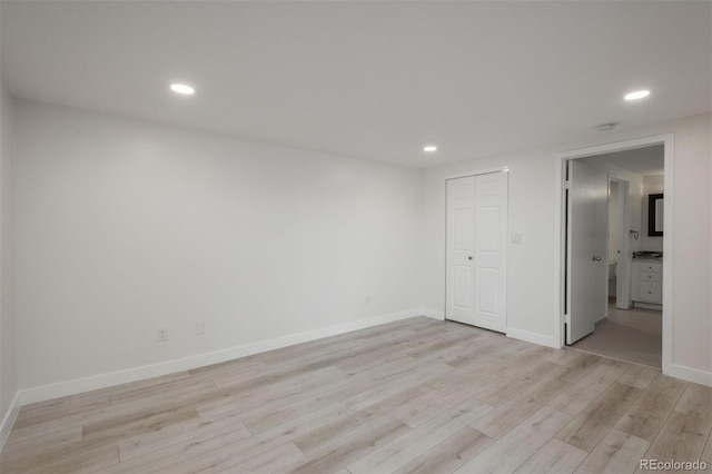 800 N Pearl St Unit 611, Denver, CO 80203 - unfurnished room with light wood-type flooring, recessed lighting, and baseboards