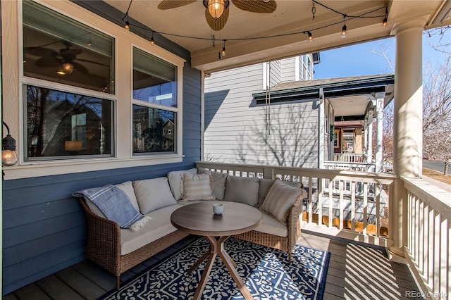 deck featuring an outdoor living space and ceiling fan