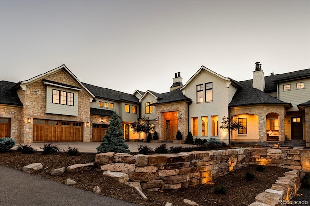 french provincial home featuring a garage