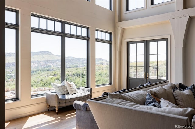 sunroom with a mountain view and plenty of natural light