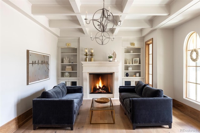 living room featuring a notable chandelier, coffered ceiling, hardwood / wood-style floors, and beam ceiling