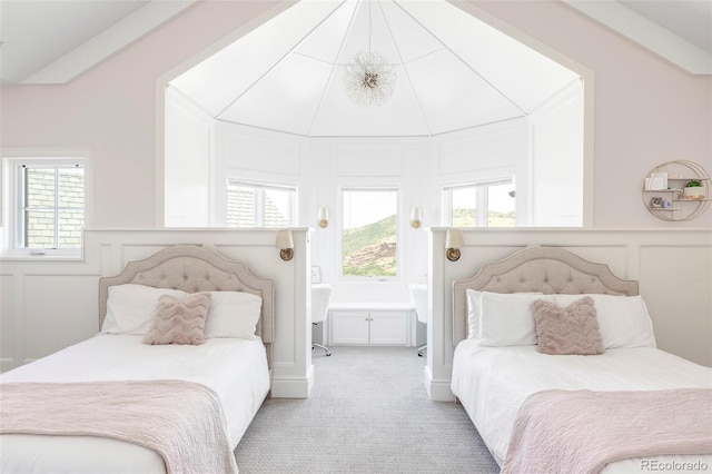 bedroom with vaulted ceiling and light carpet