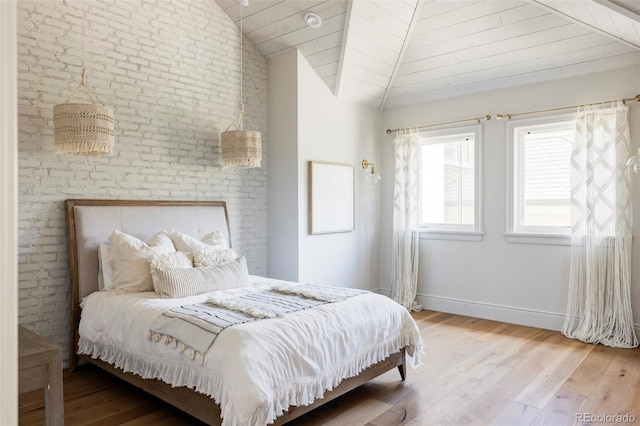 bedroom featuring lofted ceiling, wooden ceiling, and hardwood / wood-style floors