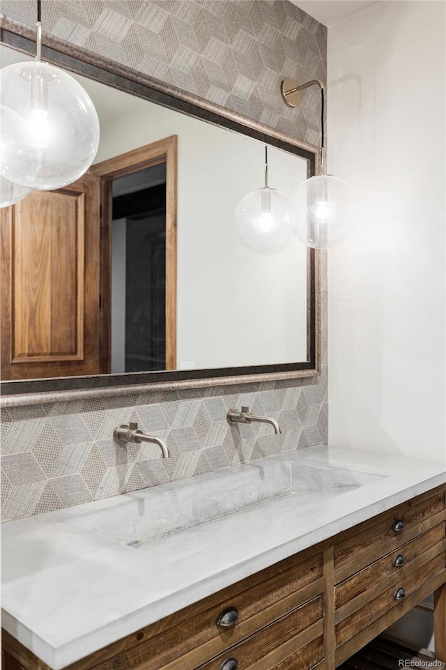 bathroom with backsplash and vanity