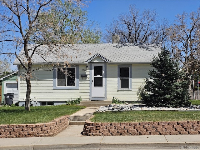 3798 S Grant St, Englewood, CO 80113 - view of front of home with roof with shingles and a front yard