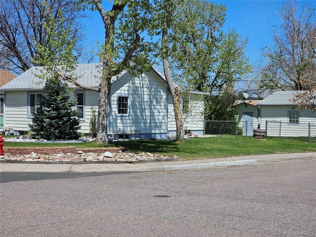 3798 S Grant St, Englewood, CO 80113 - single story home featuring roof with shingles, fence, and a front yard