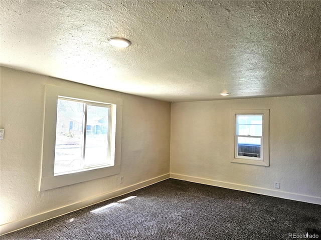 3798 S Grant St, Englewood, CO 80113 - empty room with baseboards, dark colored carpet, and a textured ceiling