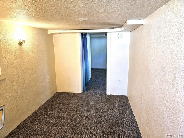 3798 S Grant St, Englewood, CO 80113 - finished basement featuring carpet floors, a textured ceiling, and a textured wall