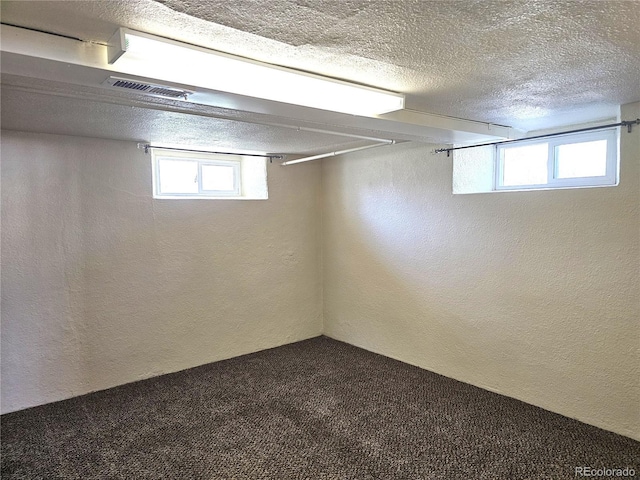 3798 S Grant St, Englewood, CO 80113 - basement with carpet flooring, a textured ceiling, a textured wall, and visible vents