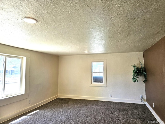 3798 S Grant St, Englewood, CO 80113 - unfurnished room featuring baseboards, dark colored carpet, and a textured ceiling