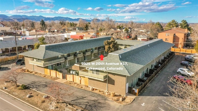 drone / aerial view featuring a mountain view and a residential view