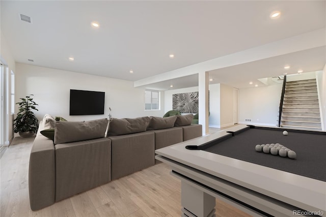 playroom with light wood-type flooring and billiards