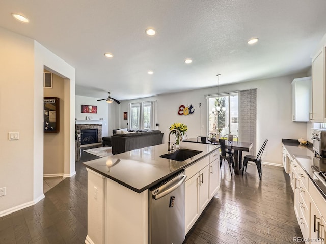 3508 E 140th Pl, Thornton, CO 80602 - kitchen featuring dishwasher, recessed lighting, a center island with sink, white cabinetry, and dark wood-style floors