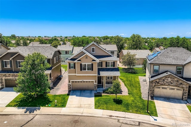 3508 E 140th Pl, Thornton, CO 80602 - craftsman inspired home with concrete driveway, stone siding, a residential view, and a front lawn