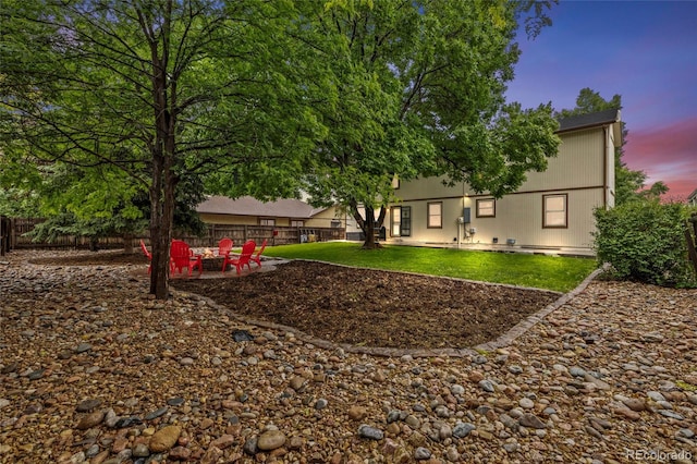 1285 Aberdeen Dr, Broomfield, CO 80020 - back of house at dusk featuring a patio area