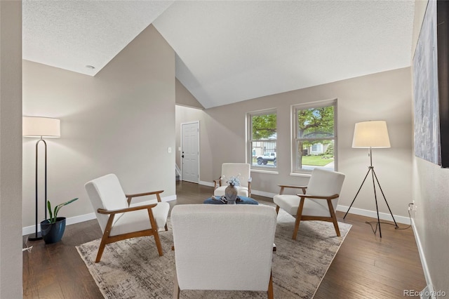 1285 Aberdeen Dr, Broomfield, CO 80020 - living room with vaulted ceiling, baseboards, and dark wood-style floors