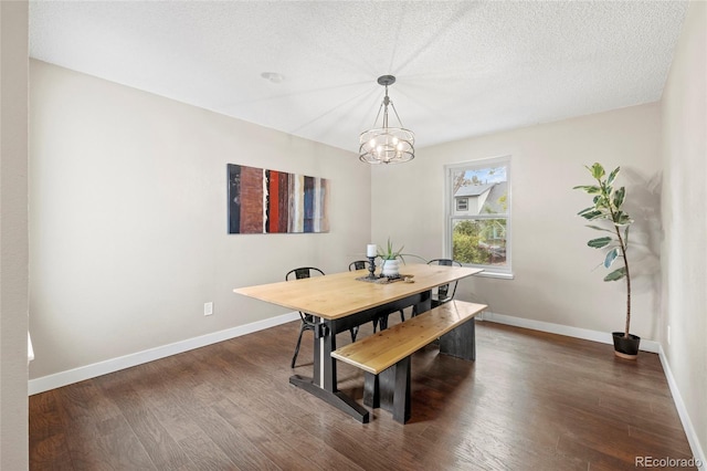1285 Aberdeen Dr, Broomfield, CO 80020 - dining area featuring dark wood-style flooring, a chandelier, baseboards, and a textured ceiling