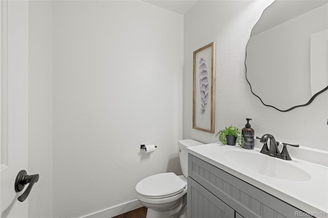 1285 Aberdeen Dr, Broomfield, CO 80020 - bathroom with toilet, vanity, and wood finished floors
