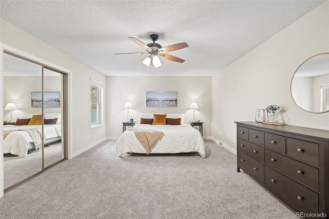 1285 Aberdeen Dr, Broomfield, CO 80020 - bedroom with light carpet, a closet, baseboards, and a textured ceiling
