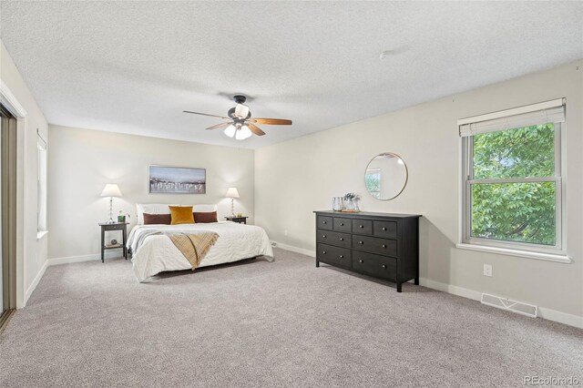 1285 Aberdeen Dr, Broomfield, CO 80020 - bedroom featuring carpet floors, a textured ceiling, baseboards, and a ceiling fan