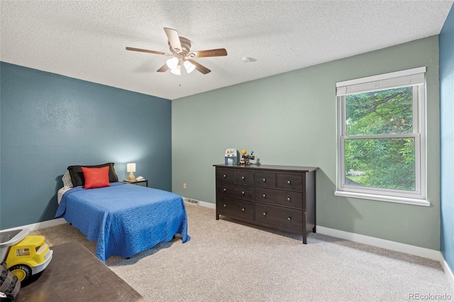 1285 Aberdeen Dr, Broomfield, CO 80020 - bedroom featuring a textured ceiling, a ceiling fan, baseboards, and carpet flooring
