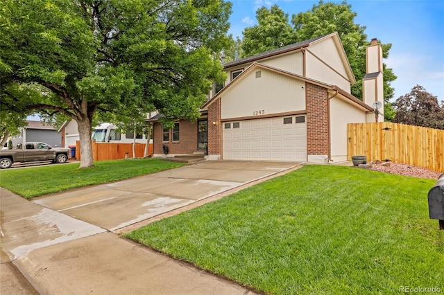 1285 Aberdeen Dr, Broomfield, CO 80020 - tudor house with an attached garage, concrete driveway, a chimney, and brick siding