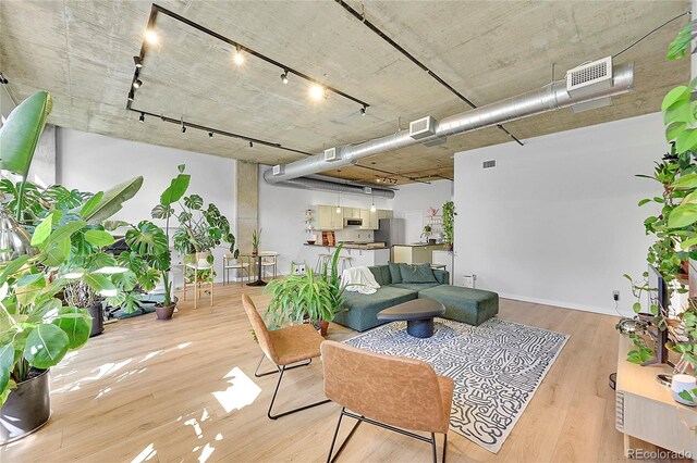 290 W 12th Ave Unit 205, Denver, CO 80204 - living area with track lighting and wood finished floors