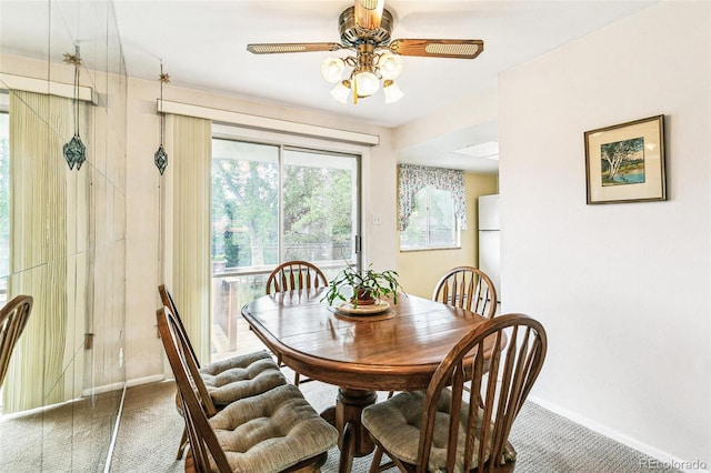 7503 Saulsbury St, Arvada, CO 80003 - dining room with carpet floors, baseboards, and a ceiling fan