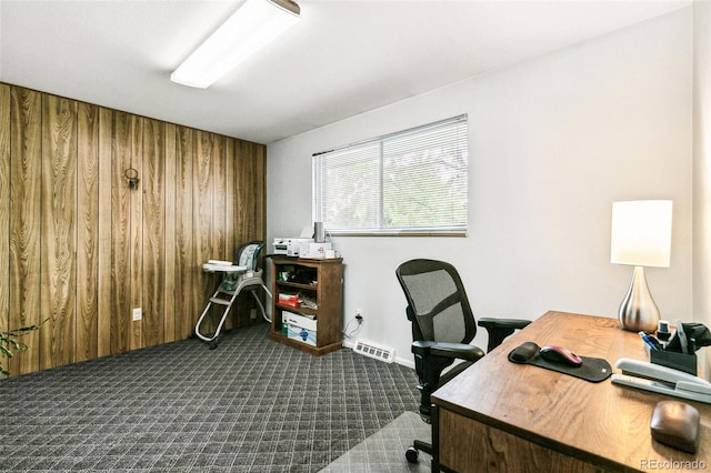 7503 Saulsbury St, Arvada, CO 80003 - home office featuring dark carpet and wood walls