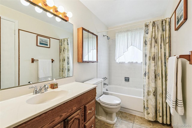 7503 Saulsbury St, Arvada, CO 80003 - bathroom featuring toilet, shower / bath combo with shower curtain, vanity, and tile patterned flooring