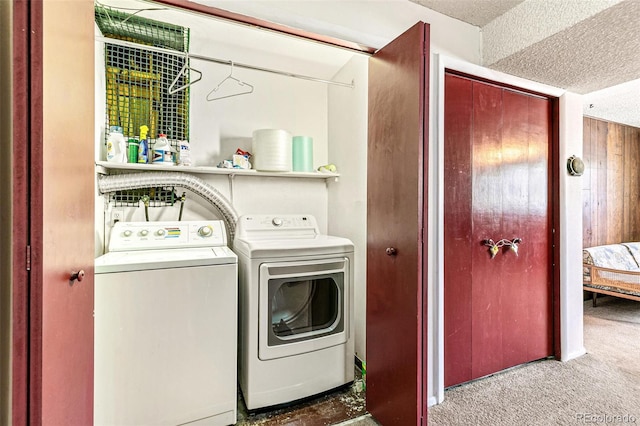 7503 Saulsbury St, Arvada, CO 80003 - laundry room featuring a textured ceiling, washer and clothes dryer, and carpet
